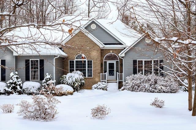 A home covered in a fresh blanket of snow.