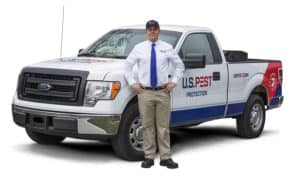 uspest-professional-beside-truck-white-background