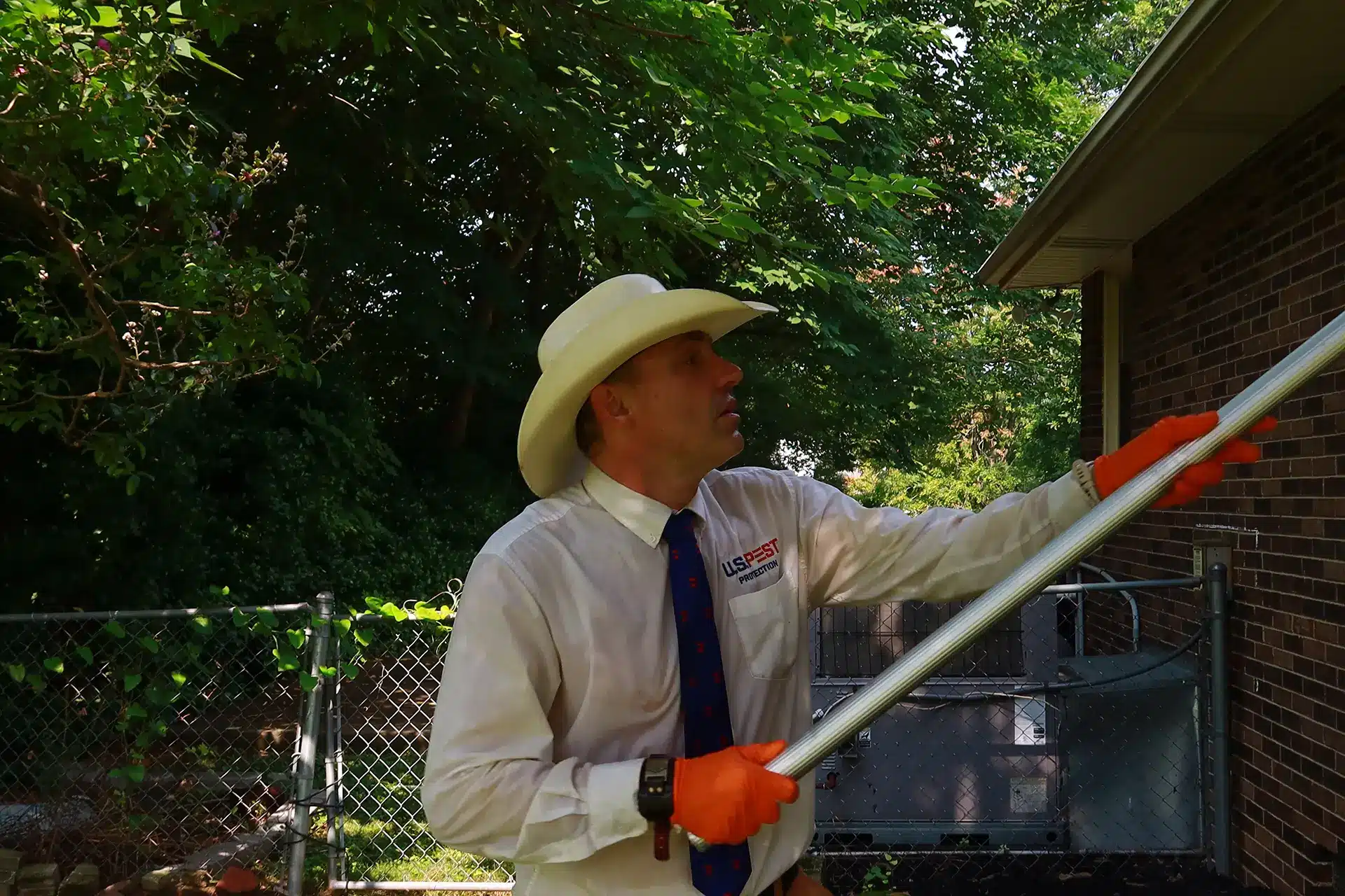What We Changed in Our Own Yard After a Tick Put J.K. in the ER 3 U.S. Pest Protection technician treating a wooded yard edge with outside rig equipment for tick control