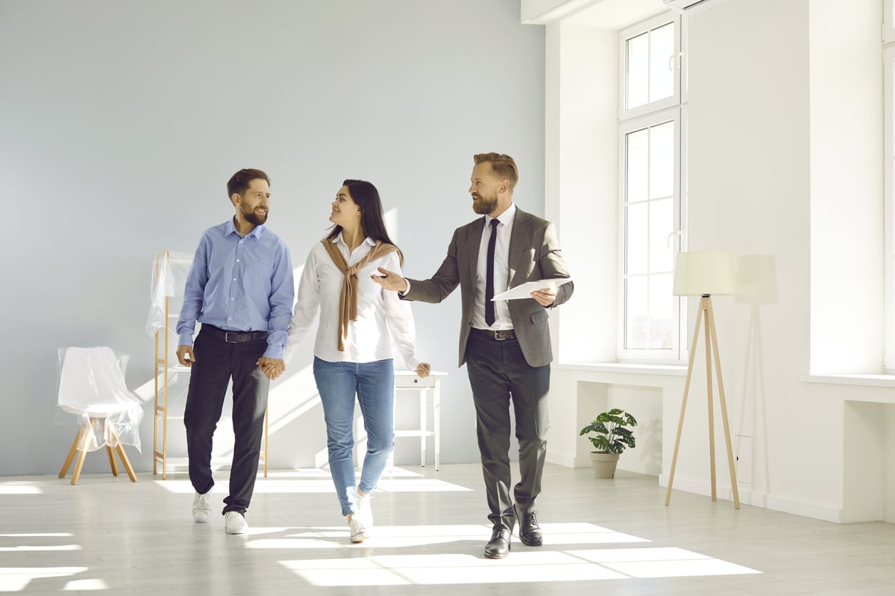 Realtor walking with potential buyer
