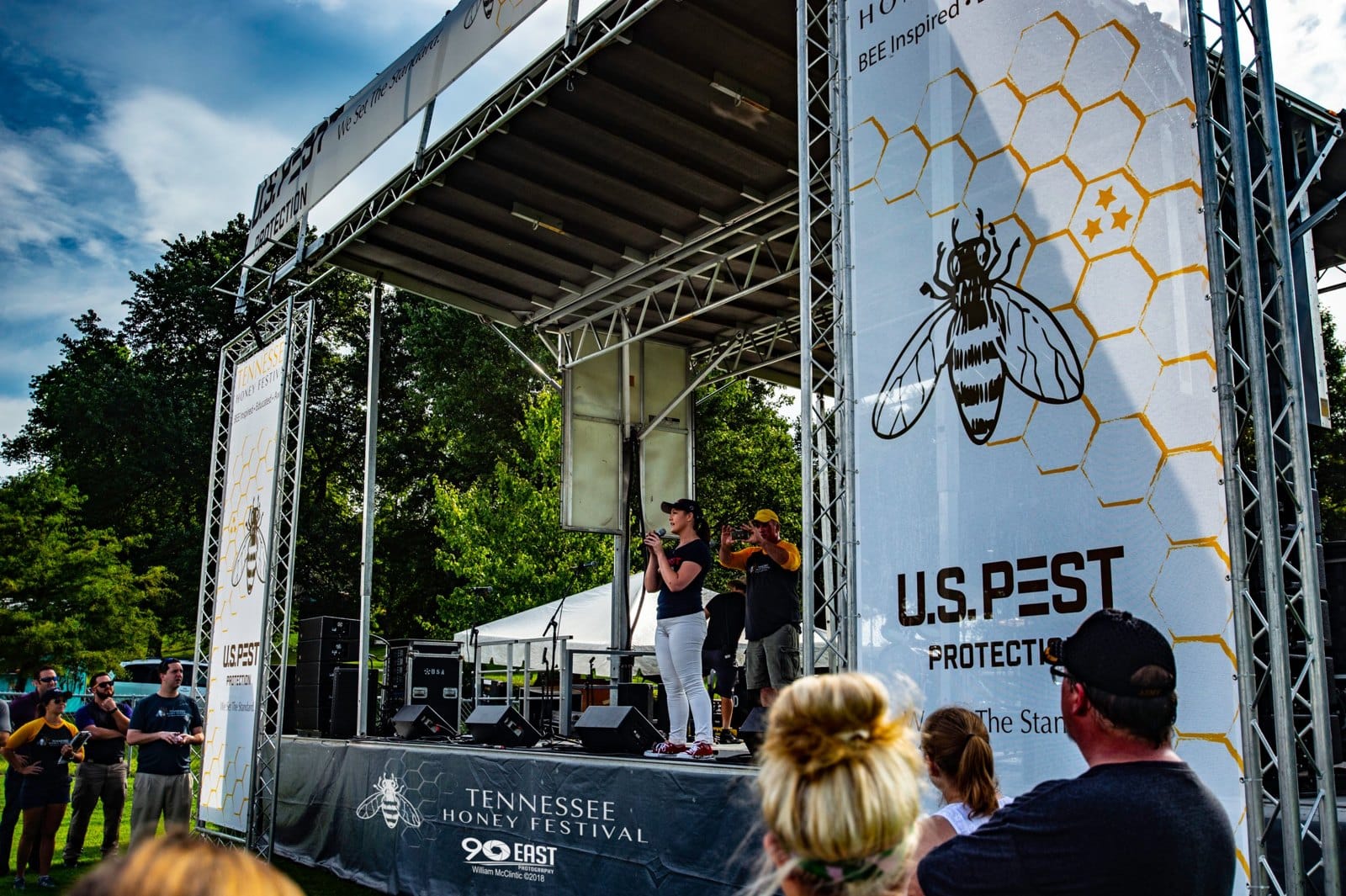 Erica Brister, President and CEO of U.S. Pest Protection, speaking on stage at the Tennessee Honey Festival